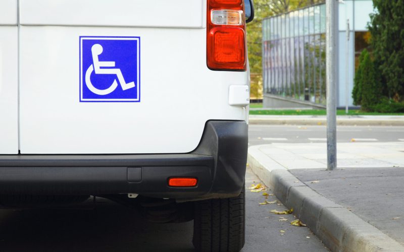 Disability sign on minivan back door, public transport accessibility